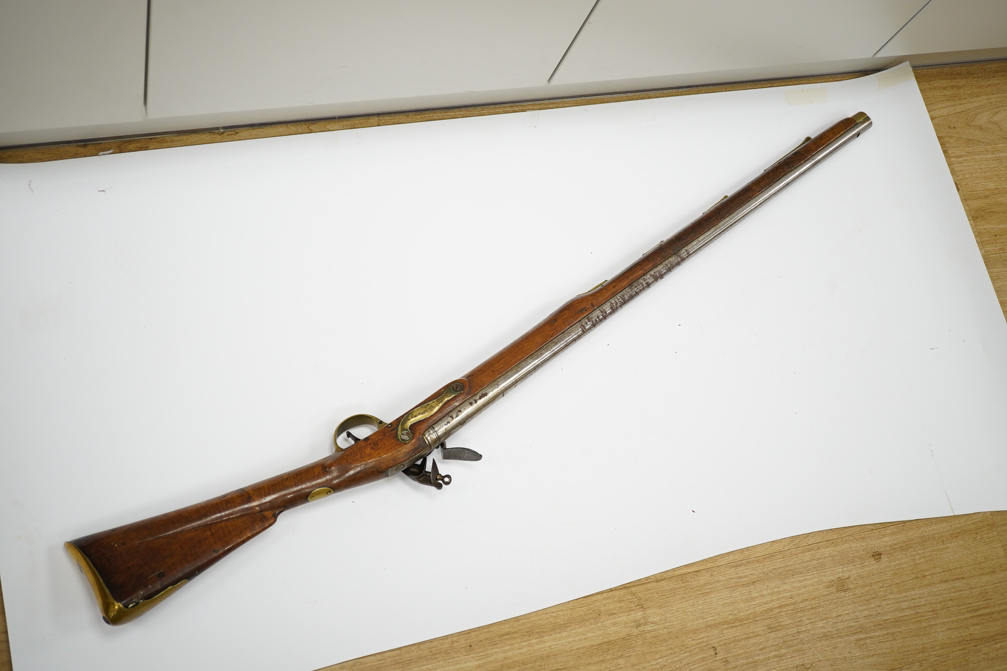 A ten bore flintlock musket of Brown Bess type, barrel 88cm, lock struck with crowned GR and Tower, regulation brass mounts. Condition - fair